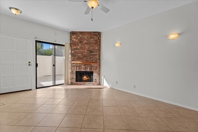 Building Photo - Light Filled Townhome Style Condo with Private Patios and Direct Access