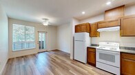 Located at 184 Tonea Way in Chico, California, this one-bedroom, one-bathroom unit offers a practical and well-designed single-floor layout. Light wood-style flooring runs consistently throughout the space, creating a clean, cohesive look that ties each room together.

The kitchen is a standout feature, offering an L-shaped configuration with abundant warm-toned wood cabinetry extending to the ceiling for generous storage. Dark granite-style countertops contrast neatly with white appliances, including a refrigerator, electric range, and dishwasher. Recessed lighting illuminates the workspace effectively, and the kitchen opens directly to the living area, enhancing the sense of openness.

The bedroom is a comfortable, well-proportioned room featuring a large window that fills the space with natural light and frames a lush, green outdoor view — a calming and pleasant focal point. Neutral walls and the same light flooring maintain a bright, airy atmosphere.

The bathroom is clean and functional, featuring a full soaking tub with a white surround, light wood-style flooring, and a brushed nickel grab bar and towel bar. The layout is straightforward and easy to navigate.

A hallway connects the rooms efficiently, completing a practical floor plan that makes thoughtful use of every square foot in this Chico residence.