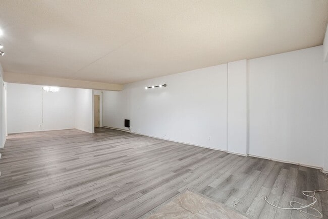 Building Photo - This expansive ground level residence is set within a serene, gated garden community surrounded b...