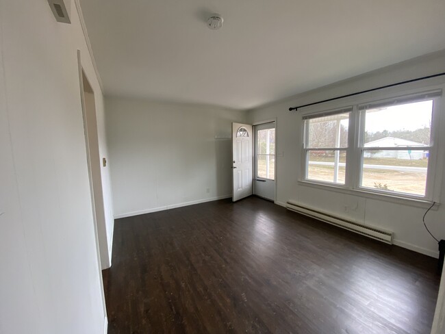 Living room looking at front wall / entry - 421 Faucette Mill Rd.