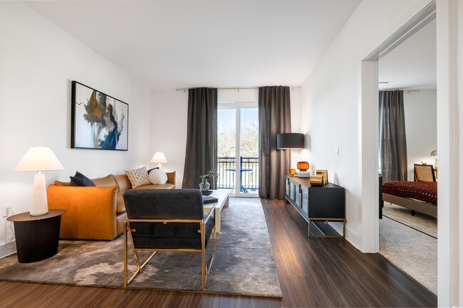 Modera Montville offers beautiful 1-, 2-, and 3-bedroom apartments with den and loft layouts, all featuring wood plank-style flooring. - Modera Montville