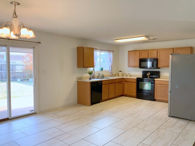 Kitchen. Fridge included - 144 Sagebrook Dr