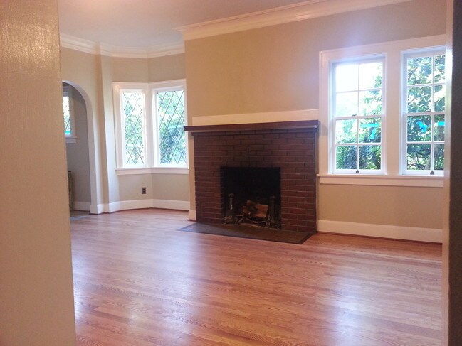 Living room with leaded glass windows - 225 NW 28th St