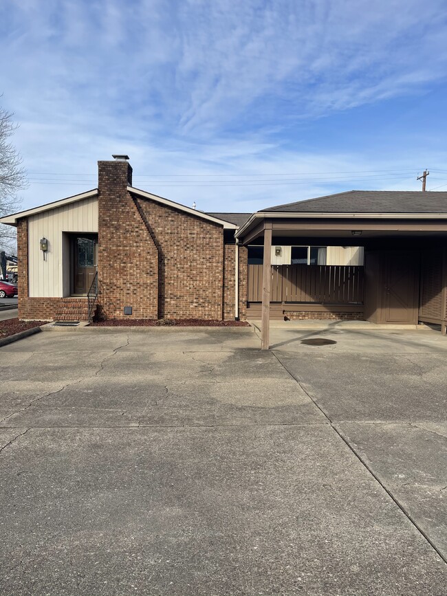 Front entrance, carport and additional parking - 120 Tennis Center Dr