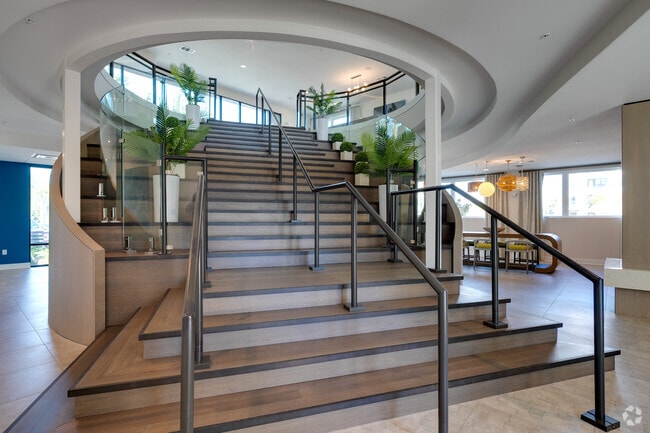 Our clubhouse has a grand staircase and two stories of elegance for you to show off to your guests! - The Reef Apartments