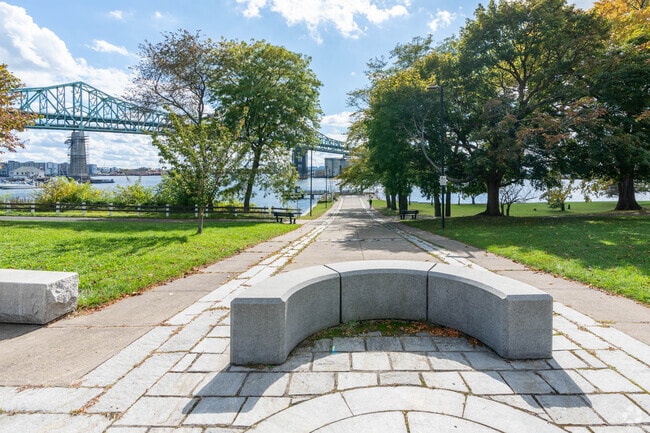 The Chelsea Naval Hospital Park provides a stone path to a deck with views of the Mystic River.