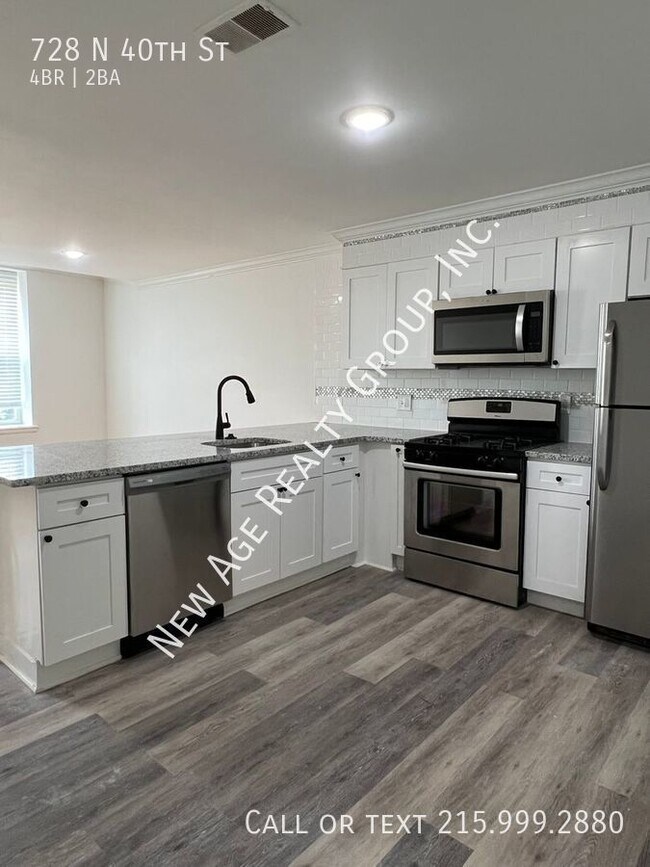 Foto del edificio - Four Bedroom, Bi-level Apartment in Belmon...