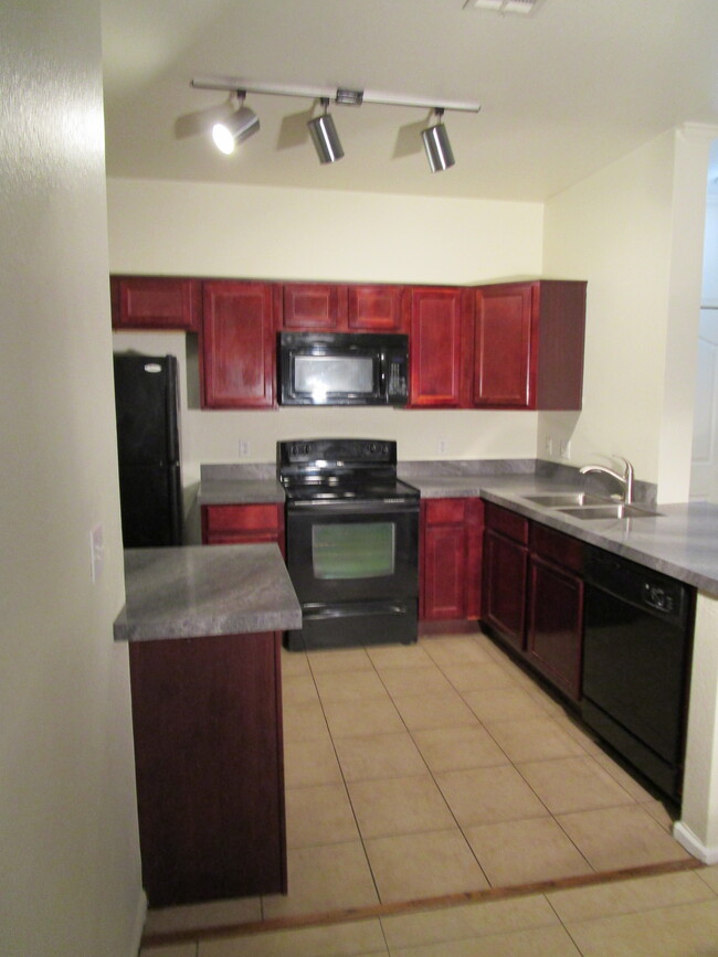 Kitchen with new granite countertops - 16013 S Desert Foothills Pky