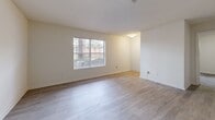 This contemporary apartment offers 860 square feet of thoughtfully designed living space. The open floor plan creates a seamless flow between the living area and kitchen, ideal for both everyday living and entertaining. The kitchen boasts modern white cabinetry, granite countertops, and stainless steel appliances, including a spacious refrigerator.

Both bedrooms feature plush carpeting and large windows that allow natural light to flood the spaces. The primary bedroom is generously sized at 180 square feet, providing ample room for a king-size bed and additional furniture. The bathrooms are equipped with modern fixtures, including bathtubs with grab bars for added safety and convenience.

The living area showcases beautiful wood-look flooring, creating a warm and inviting atmosphere. In-unit laundry facilities add to the convenience of this home. The apartment's neutral color palette provides a blank canvas for personal decorating styles.

Located at 2255 Lenox Rd NE in Atlanta, this property offers urban living with easy access to local amenities. The single-story layout ensures accessibility throughout the space. With its modern finishes, practical layout, and desirable location, this apartment presents an attractive option for those seeking a contemporary living space in Atlanta.