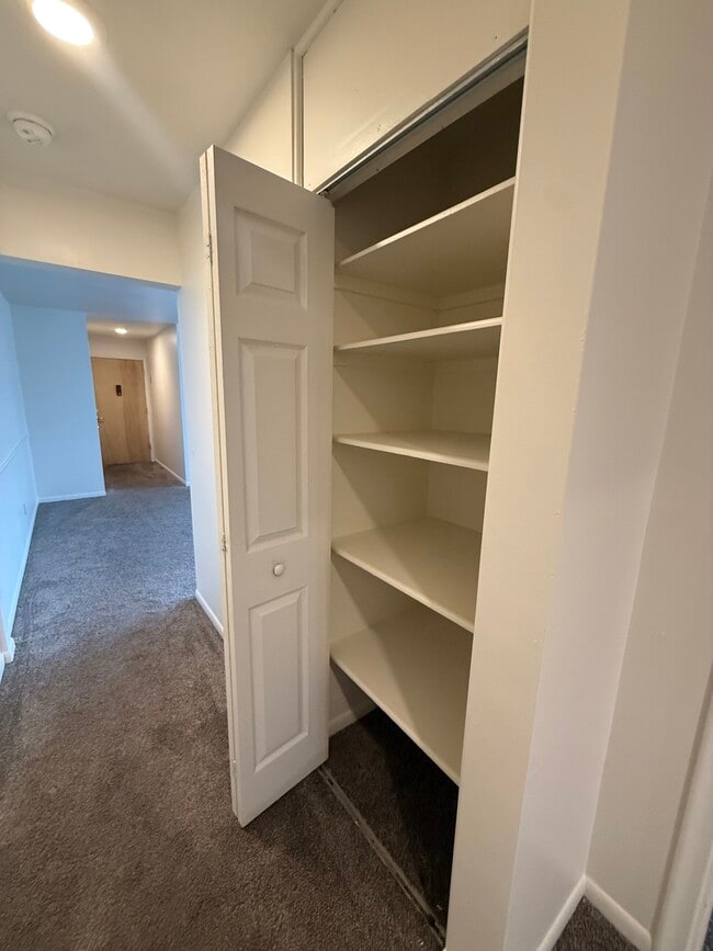 Hallway Linen Closet - MadGrey Apartments