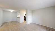 Located at 695 Normandy St in Houston, TX, this single-floor unit offers a practical and well-organized layout across two bedrooms and two full bathrooms. The open living room greets residents at the entry, featuring plush carpet flooring, a large window that fills the space with natural light, and ceiling-mounted lighting. The adjoining galley-style kitchen is efficiently designed with white cabinetry, granite-style countertops, a stainless steel sink, and black appliances including a range and refrigerator, all set on light wood-look flooring. A connecting hallway leads to the private areas of the unit. The spacious primary bedroom offers generous room to furnish comfortably, complete with soft carpet, a ceiling fan with lighting, and a window overlooking the outdoors. The second bedroom mirrors this layout with its own ceiling fan, carpeted floor, and natural light from a window. Each bedroom is supported by a dedicated closet, with one featuring built-in shelving for organized storage. Both bathrooms are finished with wood-look flooring, white tub-shower combos, and granite-style countertops. The overall aesthetic is clean, neutral, and functional throughout.