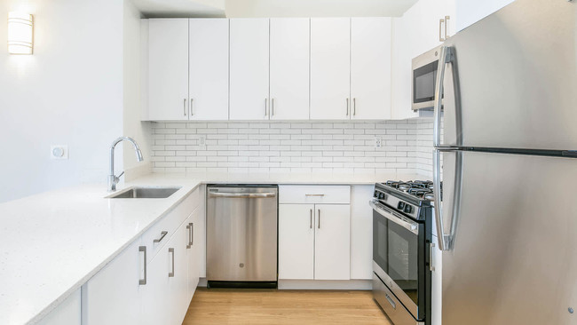 Kitchen with Stainless Steel Appliances - Academy Village