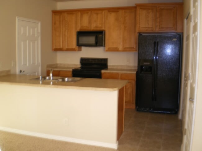 Building Photo - Ground-Level Condo in The Springs – 2-Car ...