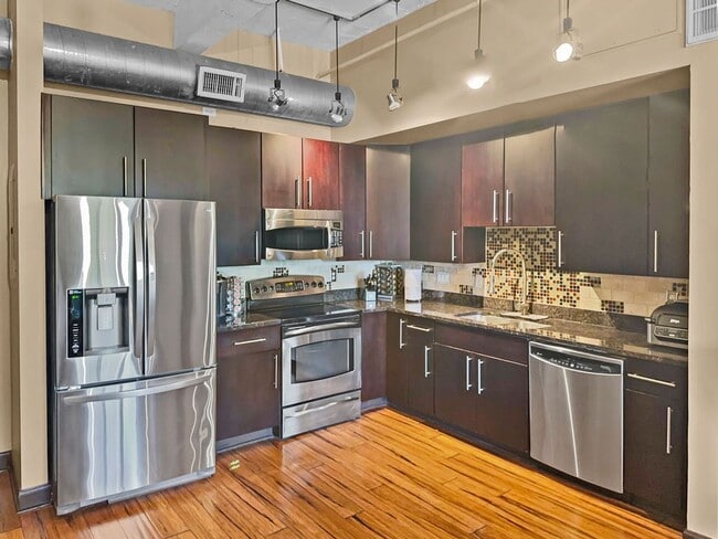 Building Photo - Modern Downtown Condo with Stunning City V...