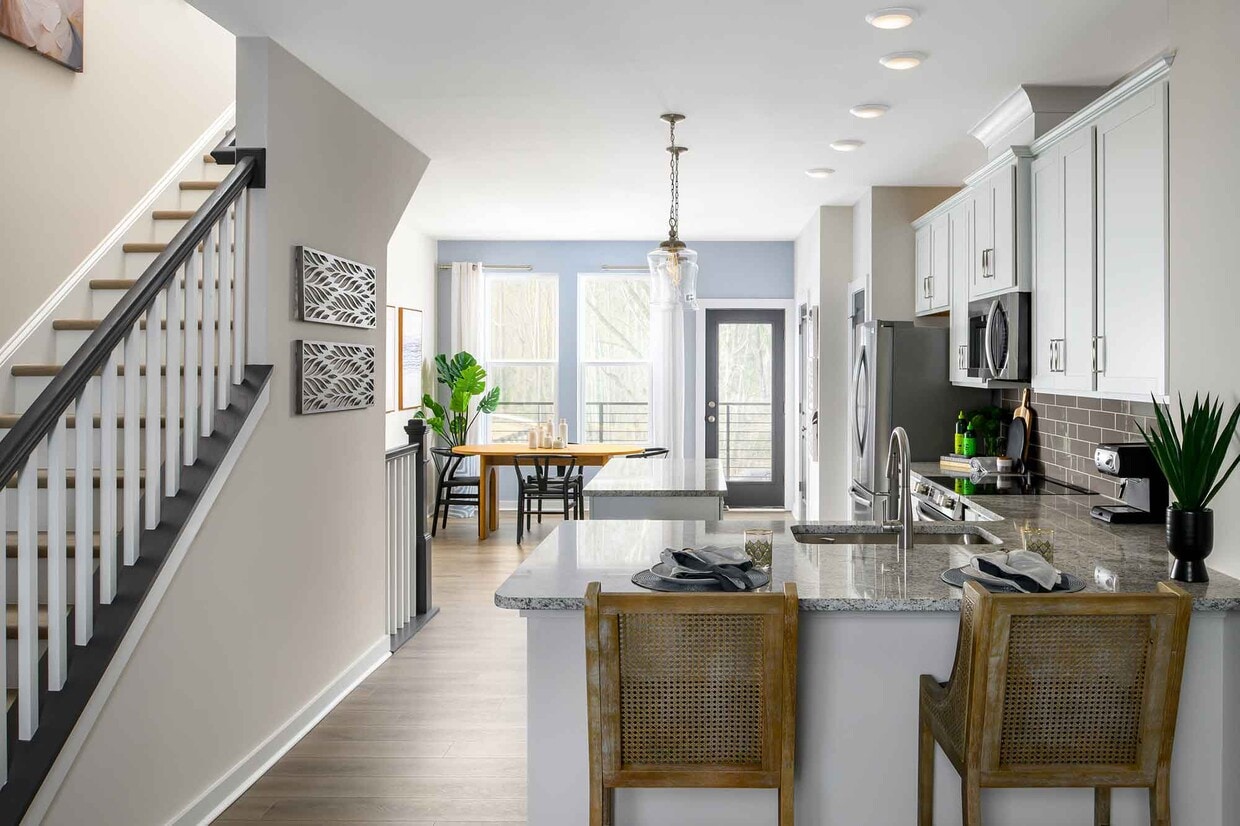 Expansive open-concept main level with 9-foot ceilings + luxury vinyl flooring - 1421 Lithium Ln