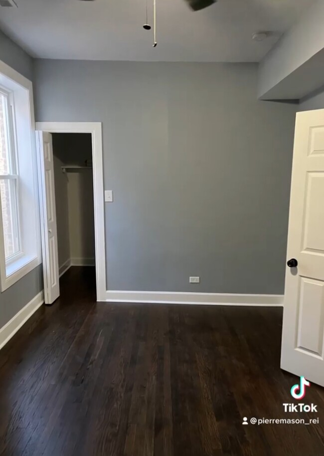 Large bed room with hardwood, large closet and ceiling fan. - 5733 S Morgan St