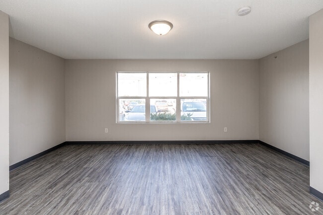 4BR, 2BA - 1,150SF - Living Room - Miller Avenue Estates