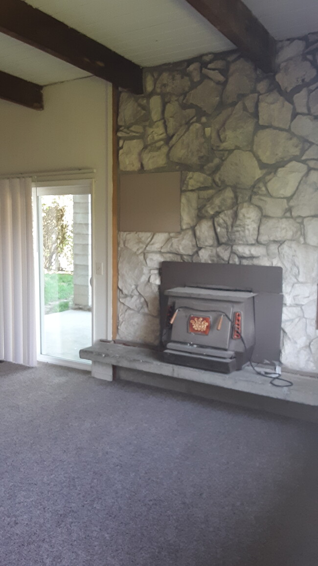 living room with fireplace - 1112 Unit B SE Cotter Pl