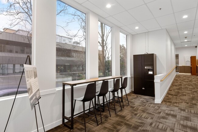 A window counter to sit and work at, with the package lockers right beside it. - The Baxter