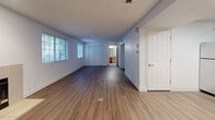 Located at 1710 NE Multnomah St in Portland, OR, this one-bedroom, two-bathroom unit offers a smart and efficient layout across a single floor. The living room serves as a welcoming focal point, featuring wood-style plank flooring, a classic fireplace, and a large window with blinds that bring in natural light and views of the surrounding greenery. The kitchen is well-equipped with warm wood cabinetry, granite countertops, a stainless steel refrigerator, range, and dishwasher, offering a clean and functional cooking space. The bedroom is carpeted for comfort, includes a window for natural light, and features a double-door closet for ample storage. The primary bathroom is conveniently accessible from the bedroom and includes a vanity with granite countertops and warm wood cabinetry, alongside a second room housing a full tub-shower combination with tile flooring. A second bathroom provides additional convenience. Throughout the unit, textured ceilings, crisp white walls, and consistent finishes give the space a cohesive and tidy aesthetic. This unit offers a practical and comfortable living environment in a well-situated Portland neighborhood.