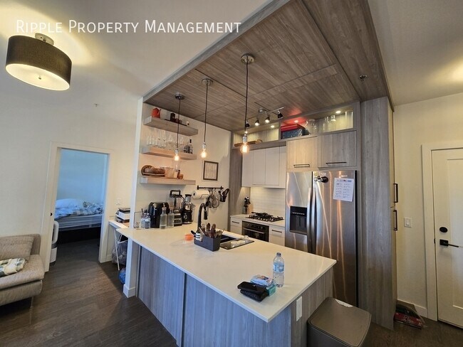 Photo du bâtiment - MODERN 2-BED, 2-BATH CONDO WITH CENTRAL A/C | PRIME SHAGANAPPI LOCATION