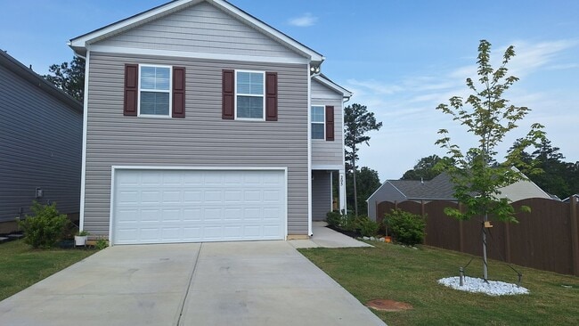 Building Photo - Lovely Four Bedroom Home  Appropriately 5 ...