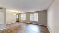 Located at 16 Beech Rd SE in Marietta, Georgia, this single-story, 2-bedroom, 2-bathroom home offers a practical and well-organized layout. The living room greets you with durable wood-look flooring, neutral-toned walls, and multiple windows fitted with blinds that fill the space with natural light. A pendant light fixture accents the entrance area, adding a subtle decorative touch.

The kitchen features gray cabinetry with ample storage, white countertops, a tile backsplash, a double-basin sink, and black appliances including a full-size refrigerator and range — providing a fully equipped cooking space.

Both bedrooms are carpeted for comfort and include ceiling fans with integrated light fixtures. Each room benefits from window views to the outdoors, keeping the spaces bright and airy. The spacious primary bedroom offers a generous footprint, while the second bedroom is equally well-appointed.

The two bathrooms are clean and functional. One features a tub/shower combination with a window for natural light and a vanity with cabinetry, while the second offers a tiled stand-up shower, a mirrored medicine cabinet, and a single-basin vanity. Wood-look flooring runs through both bathrooms, maintaining a consistent aesthetic throughout the home.