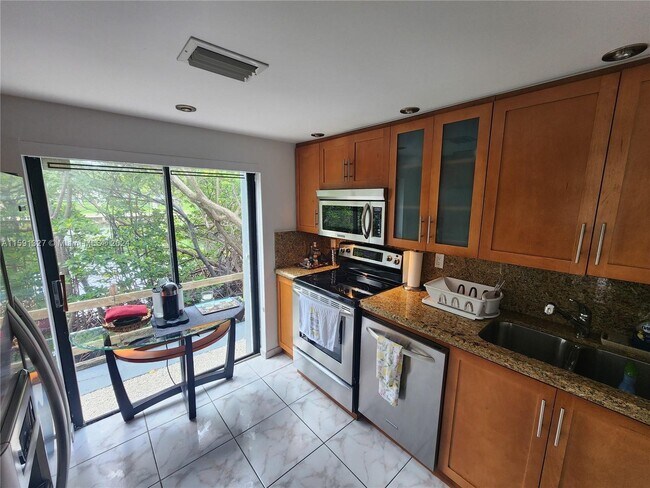 Building Photo - 201 Poinciana Island Drive Apt #101, Sunny...