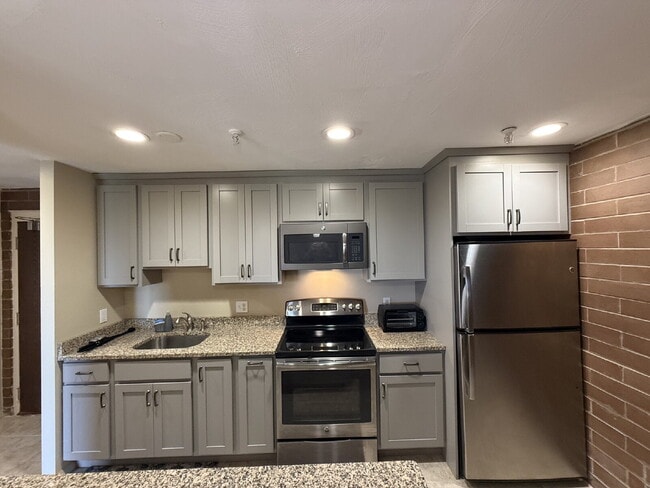 Building Photo - Modern & furnished studio unit available NOW!
