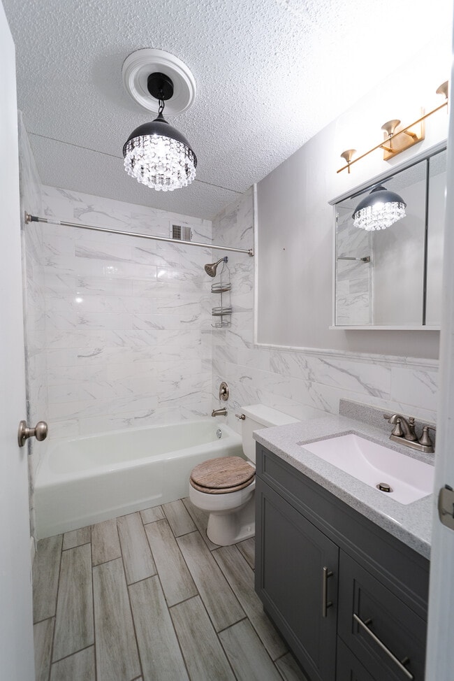 Bathroom with tile all around - 2015 S Finley Rd