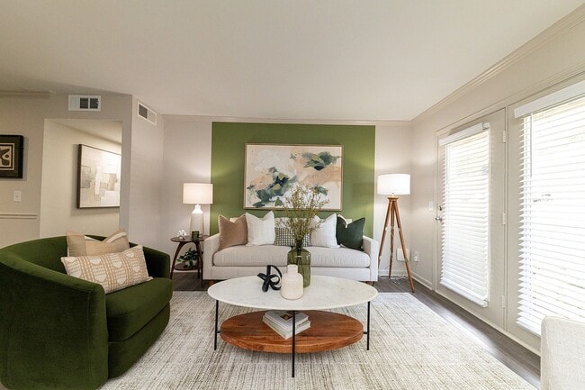Spacious living room with hardwood-style flooring - Legacy Hill