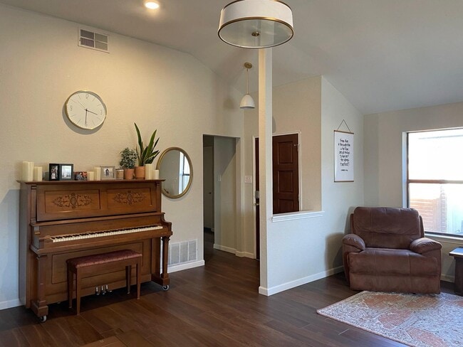 Welcoming front entry with piano and décor - thoughtfully styled for a homey feel. - 2401 Thistle Ct