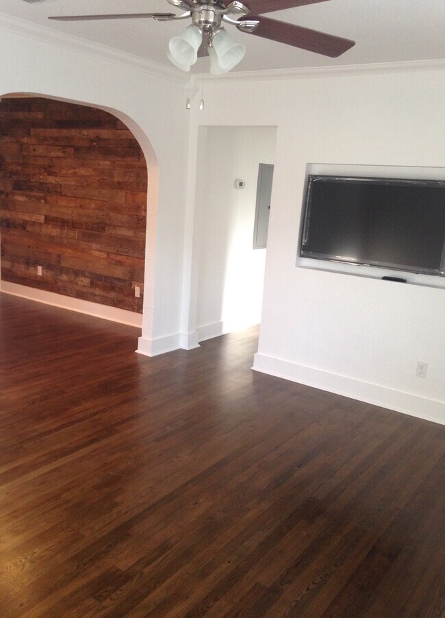 Living room & dining room with reclaimed wood walls - 1533 Yancey Street