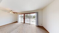 Located at 292 Lakeview Dr in Hartland, WI, this single-floor, one-bedroom, one-bathroom unit offers a comfortable and functional layout. The living area is spacious and filled with natural light, featuring neutral carpet flooring and a large sliding glass door that opens to a private balcony with a ceiling fan overhead — offering pleasant views of the surrounding trees and outdoor scenery. The galley-style kitchen is efficiently designed with warm oak cabinetry, white countertops, a double-basin sink, and tile flooring. A dedicated appliance area with open shelving provides additional storage and prep space, and the kitchen opens directly toward the living area, maintaining a connected feel throughout. The bedroom is generously sized, featuring carpet flooring, a sliding wood-paneled closet, and direct hallway access. Two hallways connect the rooms and contribute to the overall flow of the unit. The bathroom includes tile flooring, a full soaking tub with a shower surround, and a vanity with countertop space. Throughout the unit, the clean white walls, consistent finishes, and natural light create a bright, practical living environment well-suited for everyday comfort.