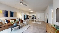 Located at 1300 N Lancaster Rd in South Elgin, IL, this 880-square-foot, single-story apartment offers 2 bedrooms and 2 full bathrooms thoughtfully arranged across a well-designed floor plan. The open-concept living room serves as the heart of the unit, featuring wood-look luxury vinyl flooring, a ceiling fan, and large windows with blinds that allow ample natural light. The adjacent kitchen is fully equipped with white cabinetry, light countertops, and black appliances including a refrigerator, range, microwave, and dishwasher. The primary bedroom spans 130 square feet and includes carpet flooring, a ceiling fan, large windows, and generous closet space with built-in wire shelving. The second bedroom mirrors the same comfortable, light-filled design. Both bathrooms feature wood-look tile flooring, white vanities with light countertops, and full tub/shower combinations with curtains. A dedicated in-unit laundry room houses a full-size washer and dryer with additional wire shelving for storage. The unit also includes a walk-in closet with wire shelving. Neutral tones and consistent finishes throughout give the apartment a cohesive, modern aesthetic.