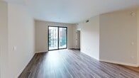 Located at 500 N Andrews Ave in the heart of Fort Lauderdale, this well-appointed 2-bedroom, 2-bathroom residence offers a thoughtfully designed open-concept layout with contemporary finishes throughout. Wood-look plank flooring flows seamlessly across the living areas and bedrooms, creating a warm and cohesive aesthetic complemented by crisp white walls and clean-lined trim.

The kitchen is a standout feature, showcasing sleek flat-front cabinetry in white, a marble-inspired tile backsplash, stainless steel appliances including a built-in microwave, range, dishwasher, and refrigerator, and a generous island with quartz countertops illuminated by pendant lighting — ideal for both cooking and entertaining.

The open living area is bright and airy, anchored by a sliding glass door that leads to a private balcony with views of the surrounding community. Both bedrooms are well-proportioned, with the primary bedroom offering dedicated closet space with built-in shelving. Each bedroom is served by its own bathroom, both finished with large-format marble-look tile flooring, wood-toned floating vanities, backlit mirrors, and clean white countertops. The primary bath features a dual-sink vanity for added convenience. Two closets provide ample storage throughout the residence.