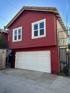 view from alley of carriage house above garage - 423 E 8th St