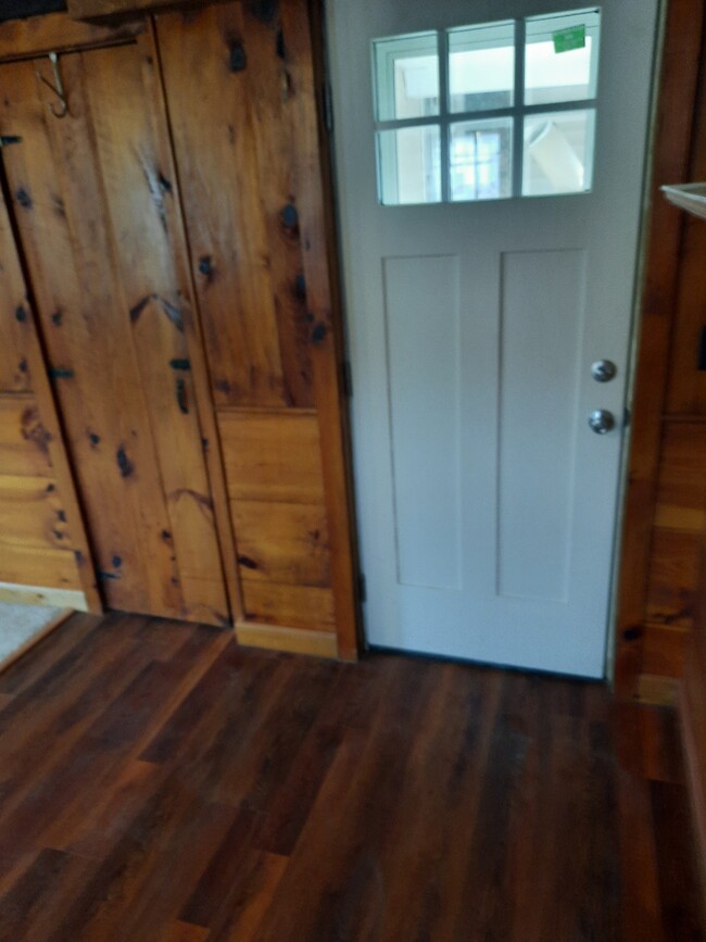 front door entry knotty pine door w/hook on top is walk in closet - 86 Forest St