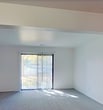 This 740 square foot apartment in South Bend, IN offers a practical and efficient living space. The single-story layout comprises three bedrooms, one bathroom, and a kitchen, all designed to maximize the available area. The primary bedroom, measuring 140 square feet, provides ample space for a comfortable retreat.

The interior features a neutral color palette with white walls throughout, creating a bright and airy atmosphere. Bedrooms are fitted with plush carpeting, while the kitchen boasts sleek hardwood flooring. Large windows in the bedrooms allow natural light to flood the space, enhancing the overall ambiance.

The modern kitchen is a highlight, featuring crisp white cabinetry, stainless steel appliances, and granite countertops. A breakfast bar separates the kitchen from the living area, offering additional seating and workspace.

The bathroom, though not extensively detailed in the images, appears to have a standard tub-shower combination and essential fixtures. The apartment's layout, as seen in the 3D model, shows a thoughtful design that separates the living areas from the bedrooms, providing privacy and functionality.

Despite its compact size, this apartment efficiently utilizes every square foot, making it an ideal choice for those seeking a cozy yet practical living space in South Bend.