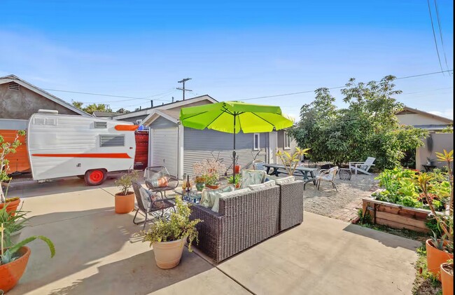 Large backyard with Seating Area and Avocado Tree - 2955 8th Ave