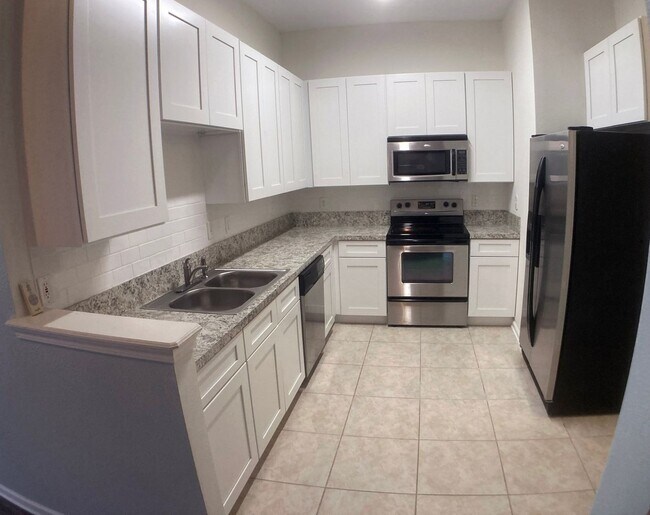 Building Photo - Spacious 3-Bedroom Condo with Pond Views &...