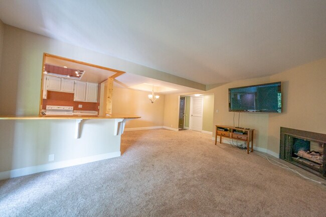 Living room/dining area opens up into kitchen. Great entertaining space. - 5482 S Springtree Ln