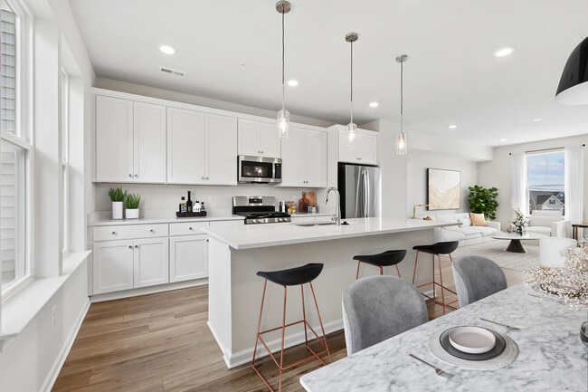 Perfect for casual dining or morning coffee at the breakfast bar. - Everstone at Cedar Hill