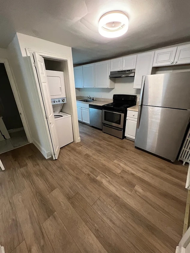 Kitchen with electric stove, dishwasher, refrigerator, and in unit washer/dryer - 12 E Lancaster Ave