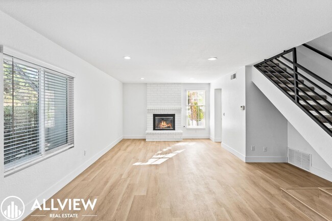 Building Photo - Upgraded 3 Bedroom Townhome in the Gated C...