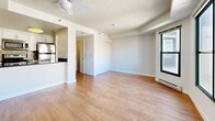Located on the 13th floor at 639 Geary Street in the heart of San Francisco, this compact unit offers an efficient and well-organized layout across a single floor. The living room is a standout space, featuring warm hardwood flooring, a textured ceiling with a ceiling fan, and two large sliding windows that frame sweeping city views of the San Francisco skyline. Baseboard heating runs along the perimeter, ensuring year-round comfort. The open-concept design connects the living area seamlessly to the kitchen, which is fitted with stainless steel appliances including a range, oven, and over-the-range microwave, complemented by dark granite countertops, white cabinetry, and a tile backsplash. The bathroom is clean and functional, featuring a full soaking tub with tiled surround, a mirror cabinet, and hardwood flooring. Two closets provide ample storage, and a hallway connects the main areas with ease. Throughout the unit, light-toned hardwood floors and neutral wall colors create a bright, cohesive aesthetic. The elevated position of the unit affords abundant natural light and striking urban views, making it an ideal base in San Francisco's vibrant Tenderloin/Lower Nob Hill neighborhood.