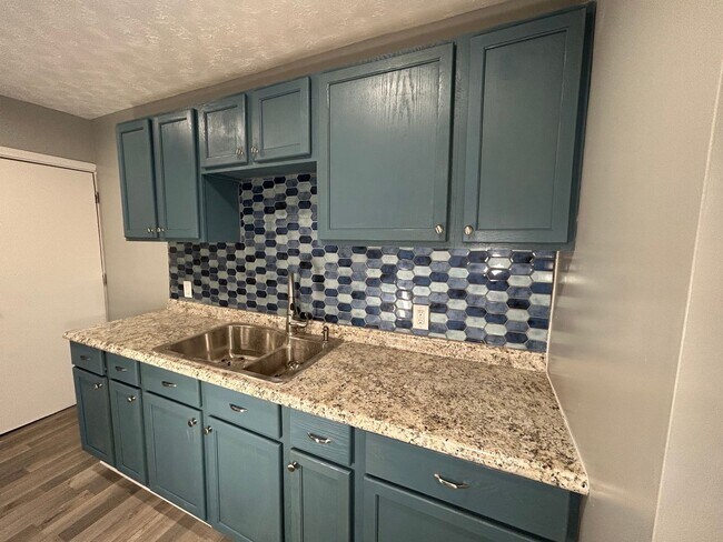 Building Photo - Embrace Comfort and Convenience in this 2-...