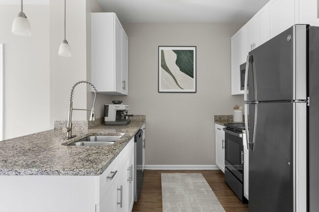 Experience culinary delight in this elegantly designed modern kitchen. - Addison at South Tryon