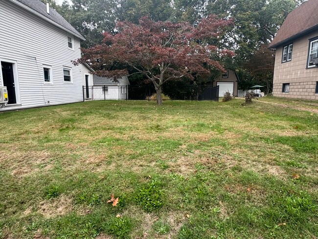 double lot yard with fencing - 205 Fair St