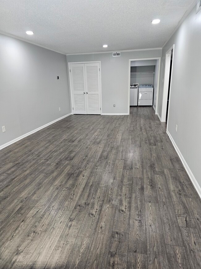 An exceptionally deep living room. plenty of space to design your perfect setup. - 8582 Chesapeake Blvd